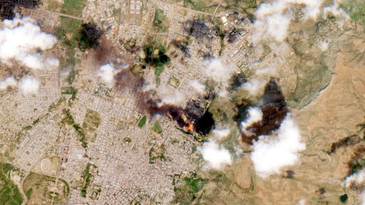 A satellite image shows smoke rising from Mekelle, following airstrikes