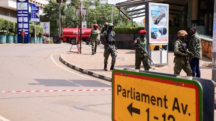 Ugandan security forces arrive to secure the scene of a blast in Kampala
