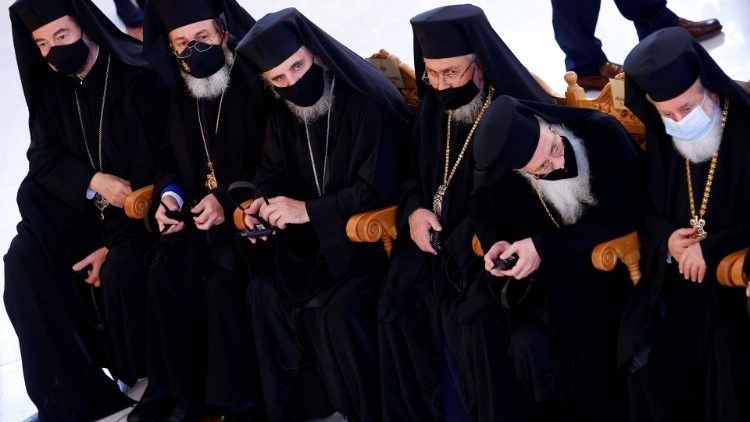 Orthodox priests wait for the arrival of Pope Francis at Apostle Varnavas Cathedral in Nicosia, Cyprus