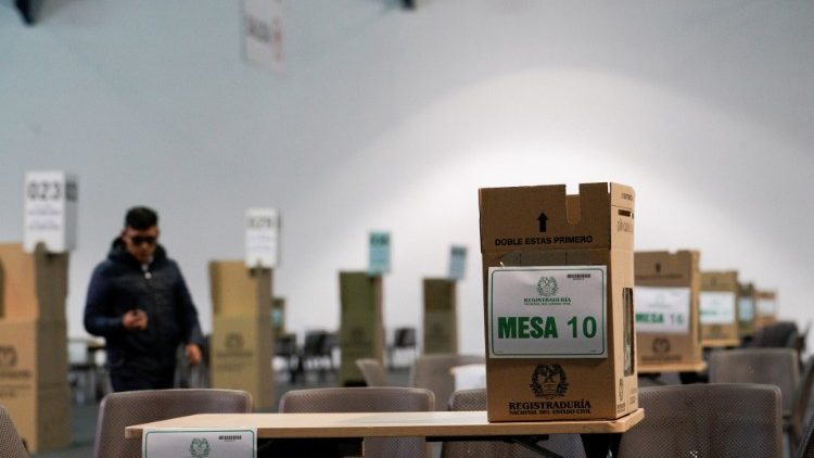 Tables and ballot boxes set up at a polling station, in Bogota