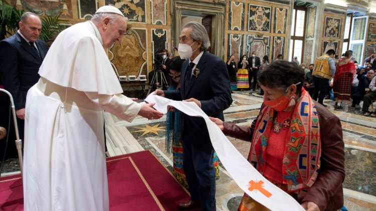 Indigenous people from Canada present the Pope with a stole during an audience on 1 April 2022
