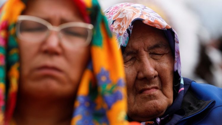 A woman reacts as Pope Francis meets with First Nations, Metis and Inuit indigenous communities is Maskwacis, Alberta, Canada