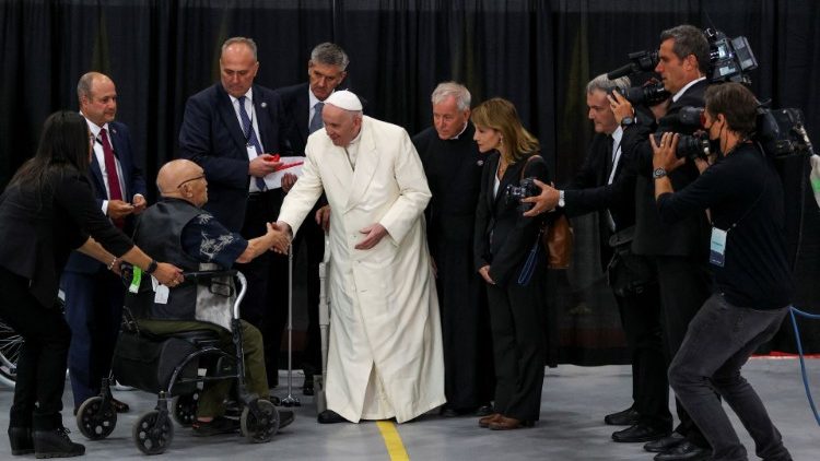 Pope Francis addresses members of the delegation that waited for him after landing in Iqaluit, Nunavut