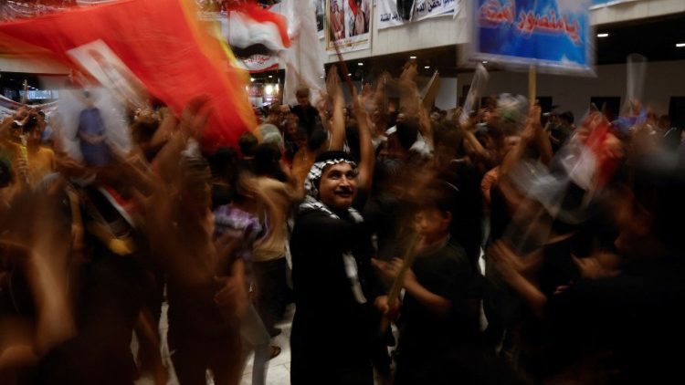 Protesters gather during a sit-in at the parliament building in Baghdad