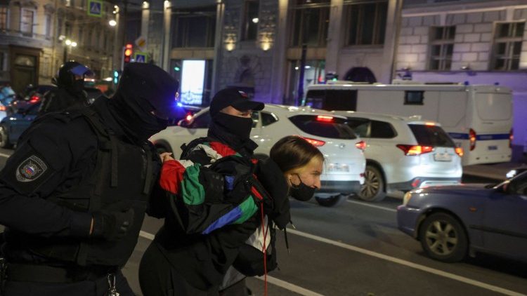 Russian law enforcement officers detain a person in Saint Petersburg