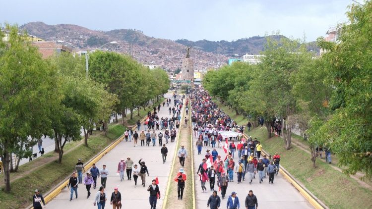 Demonstrators in Cuzco, Peru, March as the government announced a nationwide state of emergency