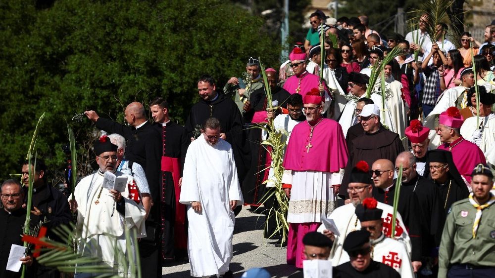 Latin Patriarch of Jerusalem Pierbattista Pizzaballa leads a Palm Sunday procession on the Mount of Olives in Jerusalem