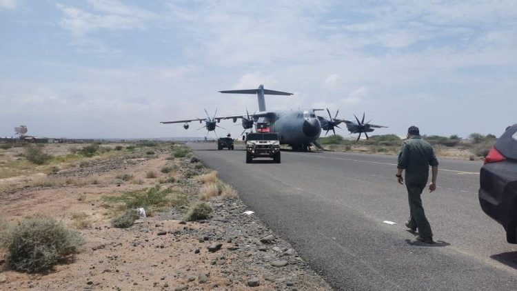 Spanish military plane and military vehicles depart on tarmac as Spanish diplomatic personnel and citizens are evacuated, in Khartoum