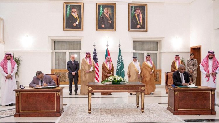 Representatives of the Sudanese army and rival paramilitary Rapid Support Forces sign an agreement for a seven-day ceasefire, in Jeddah, Saudi Arabia