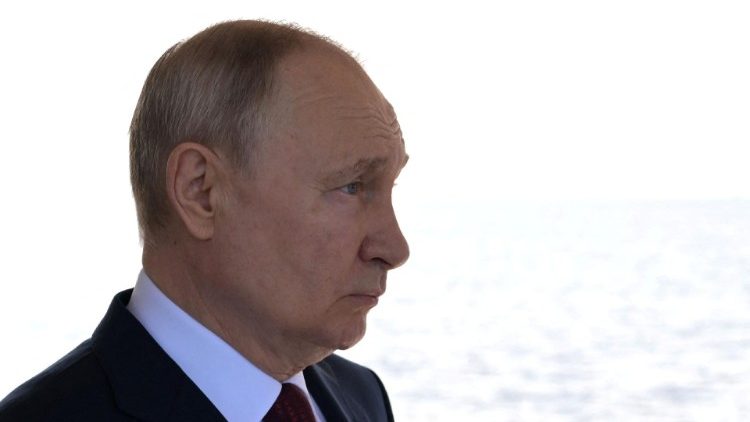 Russian President Vladimir Putin attends a flag-raising ceremony in Saint Petersburg