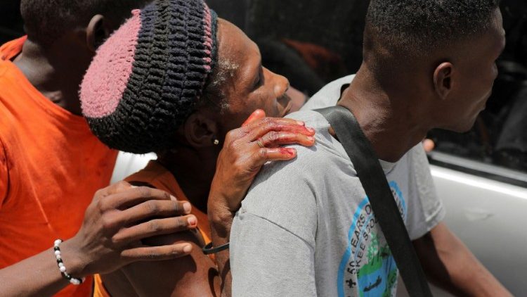 People take a wounded woman to a hospital