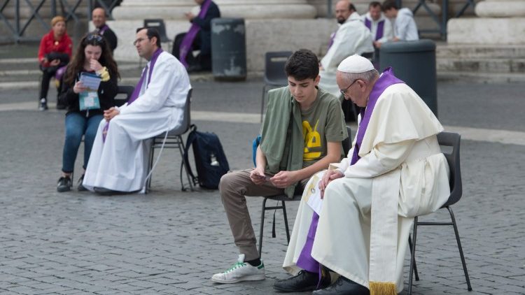 Pope Francis listens to confessions in St Peter's Square