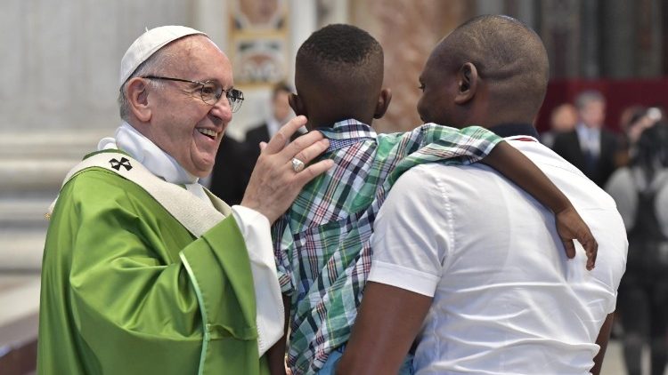 Pope Francis greets refugees at a Mass for migrants on 7 June 2018
