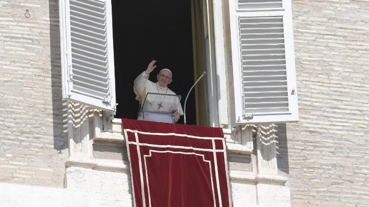 Pope Francis waves to the crowds at the Sunday Angelus
