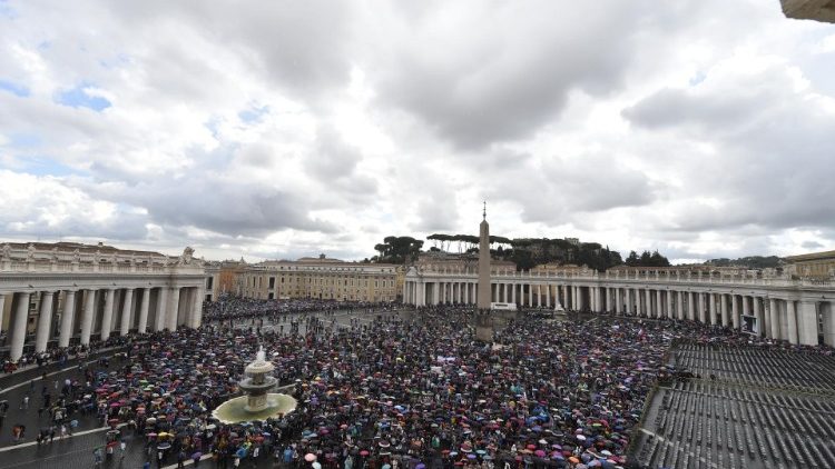 The faithful gather in a rainy Saint Peter's Square to pray the Angelus with Pope Francis.