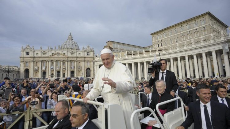 Pope Francis greets pilgrims in St Peter's Square before the weekly General Audience