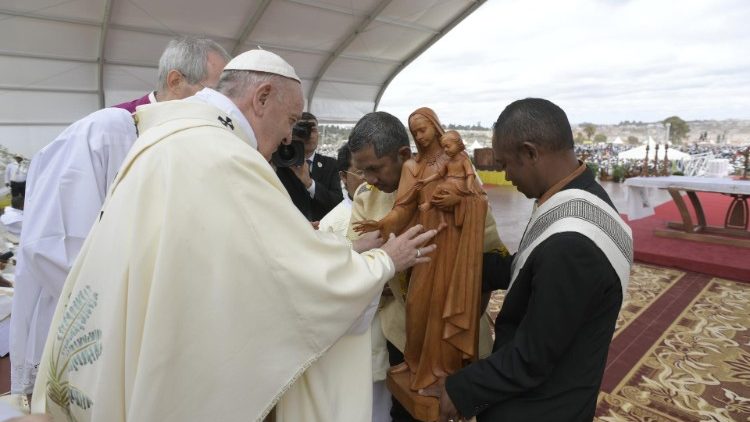 Pope Francis blesses a statue of Mary at Mass in Antananarivo