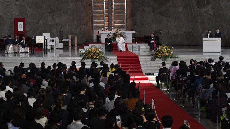 Pope Francis surrounded by young people in Tokyo's Cathedral 