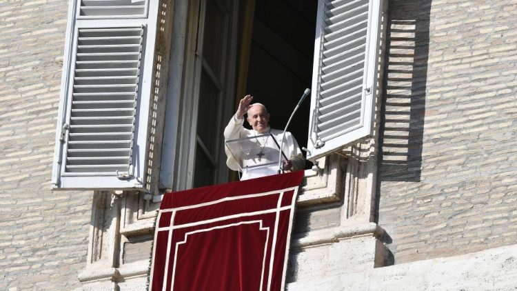 Pope Francis waves to the faithful in St. Peter's Square
