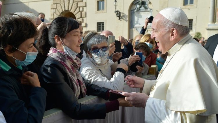 Pope Francis greets the faithful during his weekly General Audience