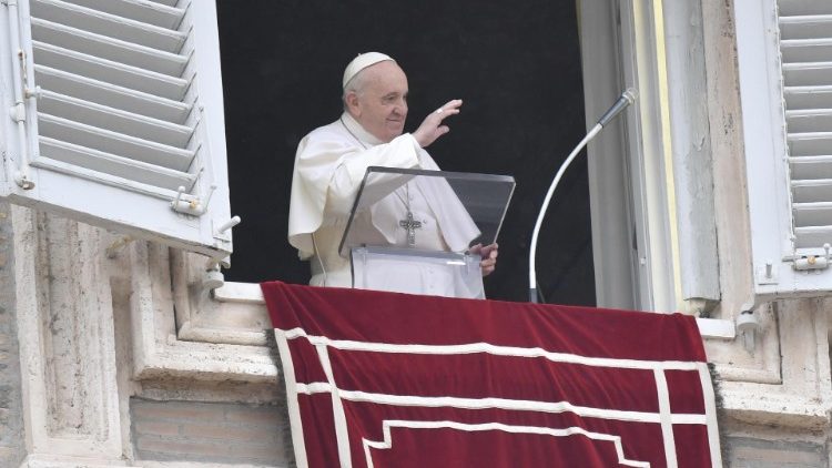 Pope Francis greets pilgrims from the window of the Apostolic Library