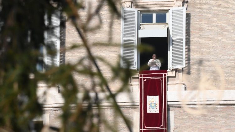 Pope Francis prays the Angelus from the window of the Apostolic Palace