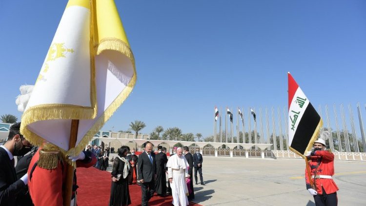 Pope Francis walks to the papal plane at Baghdad airport