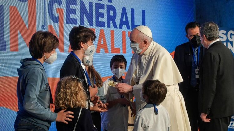 Pope Francis greets children at the conference