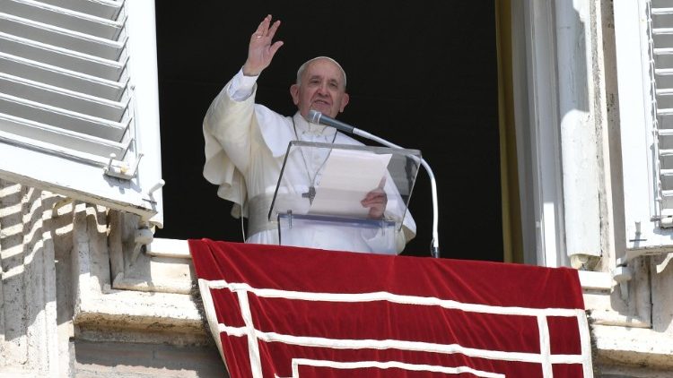 Pope Francis greets the faithful from the window of the Apostolic Palace