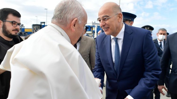  The Pope shakes hands with Nikos Dendias, Greece's foreign minister