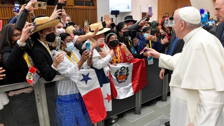 Pope Francis greets a section of the Peruvian delegation.