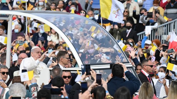 Pope Francis among the crowds as he arrives for the Mass