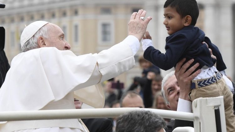 The Pope blesses a young boy