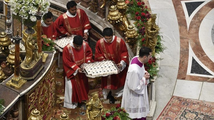The pallia are borne from the "confessio" of St Peter to be blessed by Pope Francis