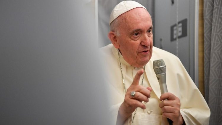 Pope Francis speaks to journalists aboard the papal plane