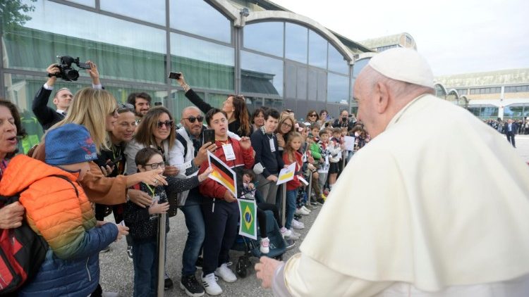 Pope Francis greets the faithful as he arrives in Assisi