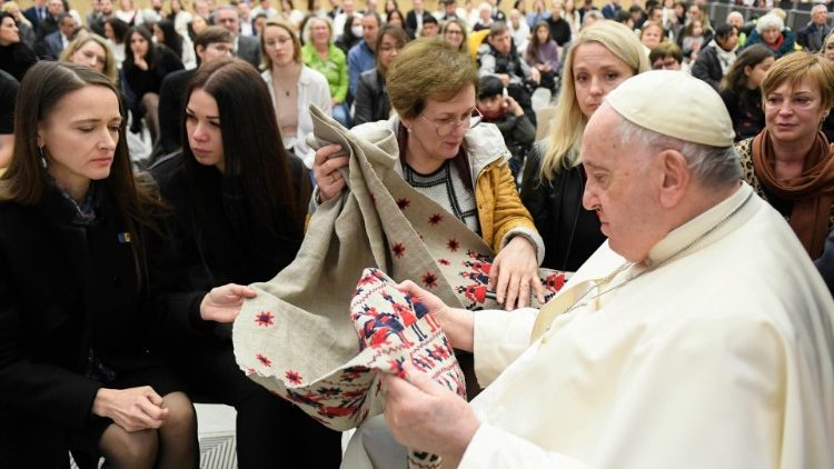 Pope Francis receiving the traditional Ukrainian blanket