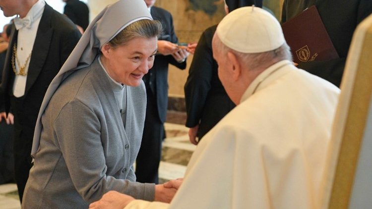 MAP Francis greets a participant after his address