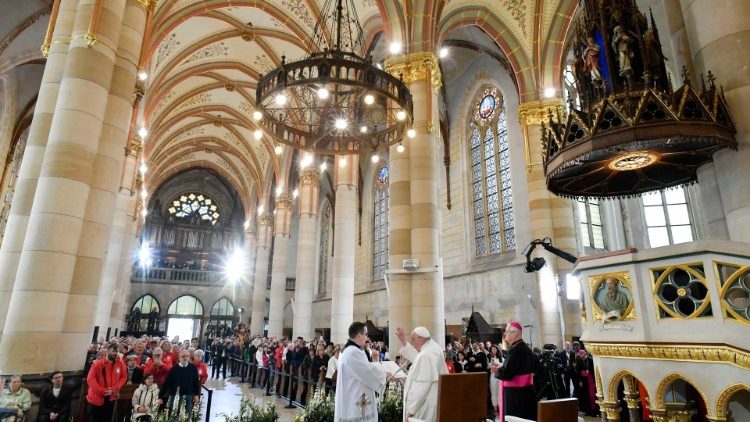 Pope Francis meeting poor people and refugees