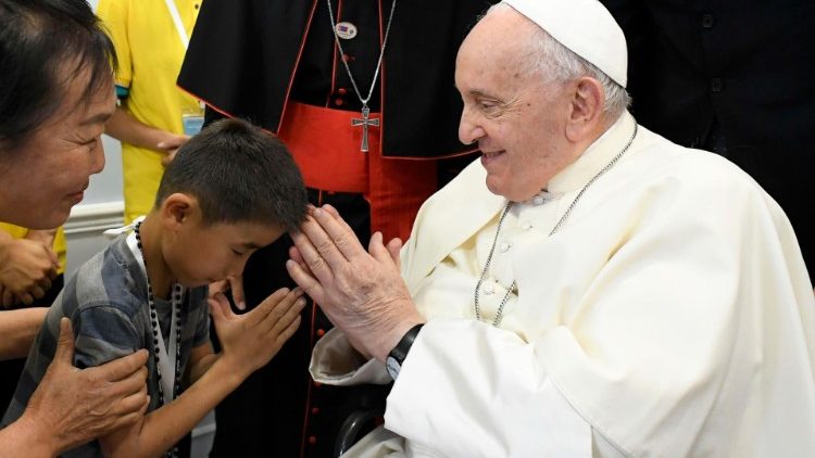 MAP Francis blesses a young boy at the "House of Mercy"