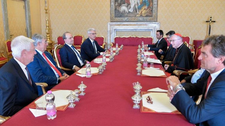 Cardinal Pietro Parolin witnesses the signing of the collaboration agreement
