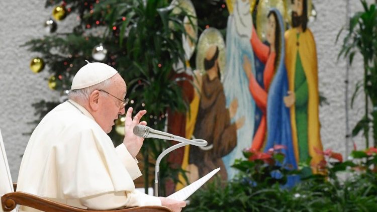 MAP Francis gestures to the Nativity Scene as he meets with Vatican employees