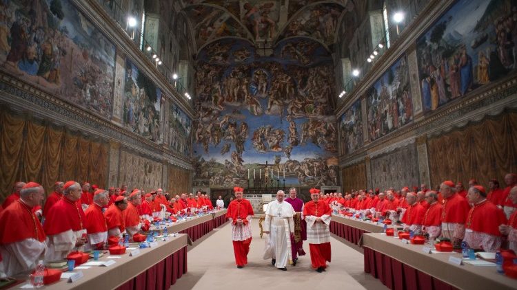 Cardinals and Pope Francis  in the Sistine Chapel