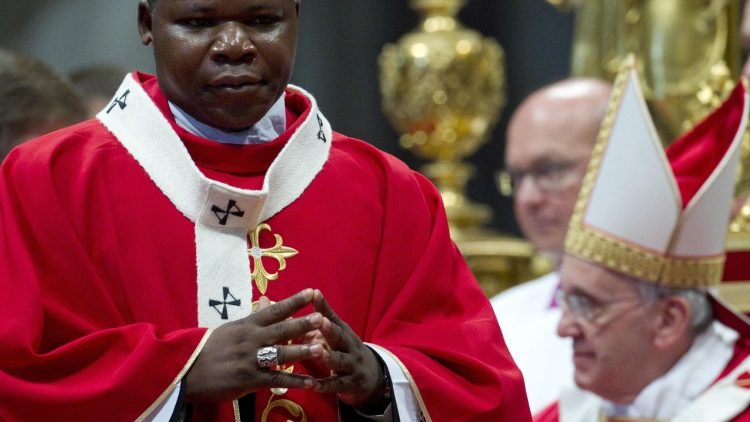 Cardinal Dieudonne Nzapalainga concelebrates Holy Mass with Pope Francis in Bangui Cathedral during the Pope's apostolic visit in November 2015
