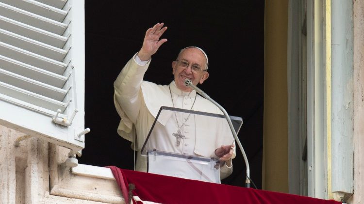 Pope Francis greets the crowds gathered in St. Peter's Square for the Angelus prayer