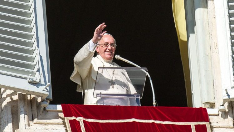 Pope Francis greets pilgrims as he leads the Angelus prayer