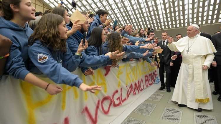 Pope Francis greets young people at his general audience.