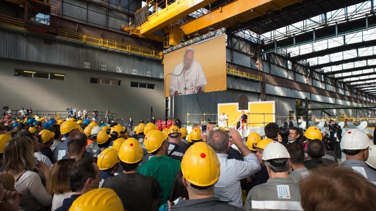 Pope Francis addresses workers at the ILVA steel company during a visit to Genoa in 2017