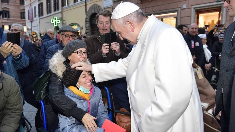 Pope Francis blesses a  lady with disabilities