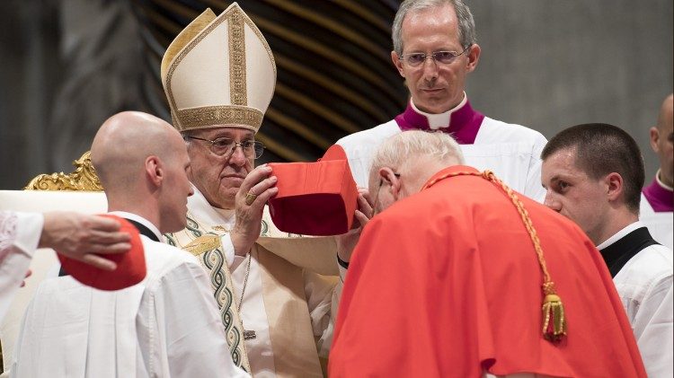 Pope Francis placing the red hat on a new cardinal during the Consistory of June 28, 2017. 